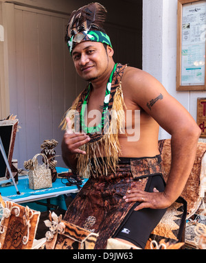 Artist with his handcrafted kapa artworks in the Kona Inn Shopping Village on the Big Island of Hawaii Stock Photo