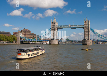 River Traffic passing under Tower Bridge in London Stock Photo