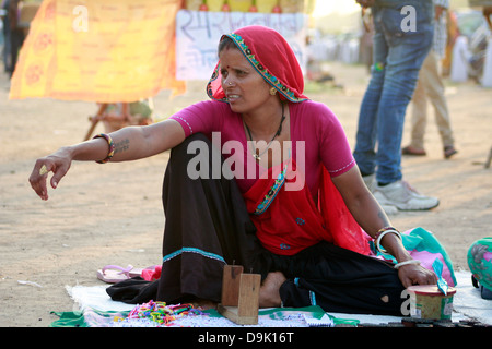 Gypsy woman selling decorative beads in New Delhi India Stock Photo