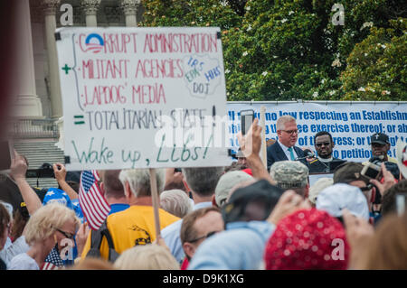 Washington DC, USA. 19th June, 2013. Tea Party Patriots Anti-IRS & Anti Illegal Immigration demonstration on Capitol mall, Washington, DC  Major speakers included Glenn Beck, Rand Paul and Michelle Bachman.  Crowd estimate between 10,000 - 15,000. Stock Photo