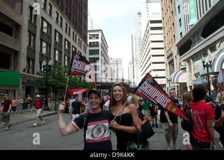 Jun 11, 2010 - Chicago, Illinois, U.S. - Fans wave their championship flags in the Loop. Parade on Michigan Avenue to celebrate the Stanley Cup 2010 championship win of the Chicago Blackhawks hockey team. Chicago Blackhawk players and organization members ride on top of English double decker buses greeting the crowd that has gathered to honor them. (Credit Image: © Karen I. Hirsch/ZUMAPRESS.com) Stock Photo