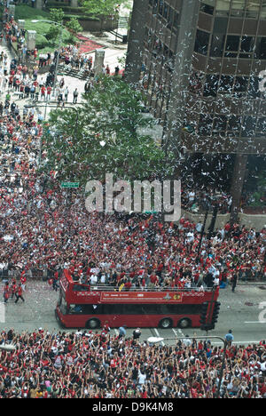 Jun 11, 2010 - Chicago, Illinois, U.S. - Parade on Michigan Avenue to celebrate the Stanley Cup 2010 championship win of the Chicago Blackhawks hockey team. Chicago Blackhawk players and organization members ride on top of English double decker buses greeting the crowd that has gathered to honor them. (Credit Image: © Karen I. Hirsch/ZUMAPRESS.com) Stock Photo