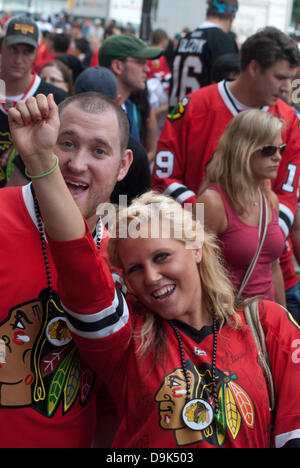 Jun 11, 2010 - Chicago, Illinois, U.S. - Fans show their support of the Chicago Blackhawks. Parade on Michigan Avenue to celebrate the Stanley Cup 2010 championship win of the Chicago Blackhawks hockey team. Chicago Blackhawk players and organization members ride on top of English double decker buses greeting the crowd that has gathered to honor them. (Credit Image: © Karen I. Hirsch/ZUMAPRESS.com) Stock Photo