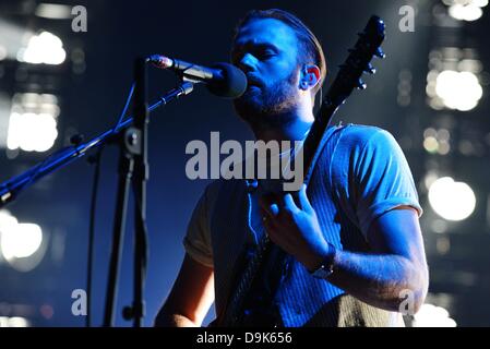 Cologne, Germany. 20th June, 2013. Singer and guitarist Caleb Followill of the US rock band 'Kings of Leon' is pictured during a concert at the Lanxess Arena in Cologne, Germany, 20 June 2013. Photo: Jan Knoff/dpa/Alamy Live News Stock Photo