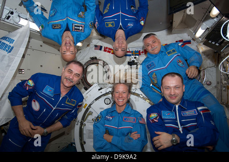 Floating inside the Kibo laboratory in the International Space Station, the six Expedition 36 crew members videotape a tribute to cosmonaut Valentina Tereshkova, who on June 16 will mark the 50th anniversary of her 1963 launch aboard the Soviet Vostok-6 spacecraft June 8, 2013. On the bottom row from left are Expedition 36 Commander Pavel Vinogradov of Russia's Federal Space Agency and Flight Engineers Karen Nyberg of NASA and Alexander Misurkin of Roscosmos. On top are from left Flight Engineers Luca Parmitano of the ESA, Chris Cassidy of NASA and Fyodor Yurchikhin of Roscosmos. Stock Photo