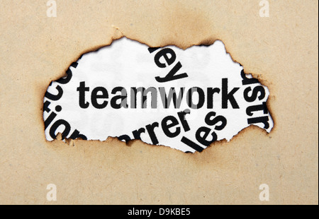 Teamwork text in paperhole Stock Photo