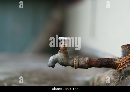 Dripping water faucet outdoor Stock Photo