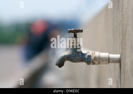 Dripping water faucet outdoor Stock Photo