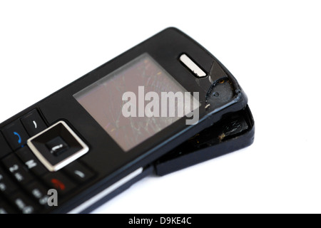 A broken old mobile phone isolated on white Stock Photo