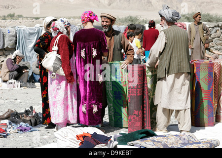 Afghan carpets on sale, transborder market near Ishkashim on the border between Tajikistan and Afghanistan Stock Photo