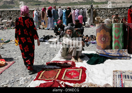 Afghan carpets on sale, transborder market near Ishkashim on the border between Tajikistan and Afghanistan Stock Photo