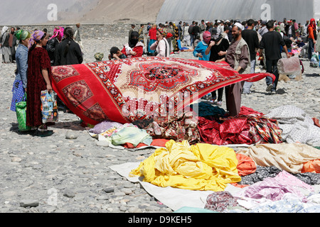 Afghan carpets on sale, transborder market near Ishkashim on the border between Tajikistan and Afghanistan Stock Photo
