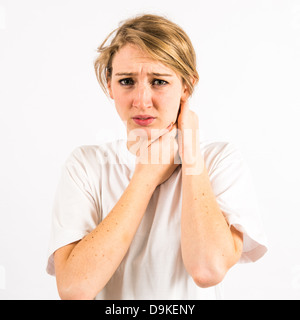 A young woman with long blonde hair suffering from a sore throat neck Stock Photo
