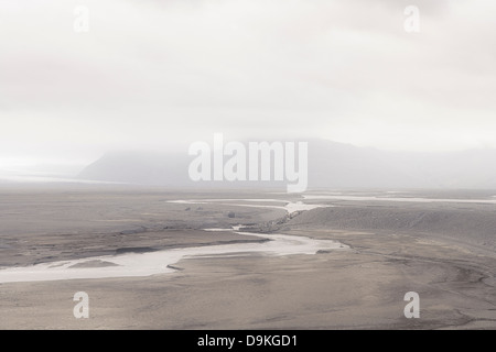 Stream in misty landscape Stock Photo