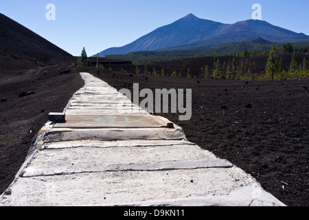 Covered water channel near Arenas Negras with Teide in the background, transports water from Los Realajos over to Guia de Isora Stock Photo