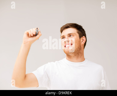 man writing something in the air Stock Photo