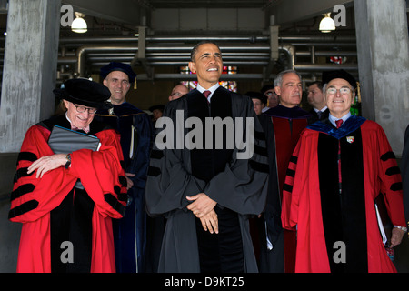 US President Barack Obama joins The Ohio State University President E. Gordon Gee, left, and others before the start of commencement at Ohio Stadium May 5, 2013 in Columbus, Ohio. Stock Photo