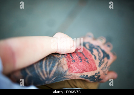 Father holding newborn baby boy's hand Stock Photo