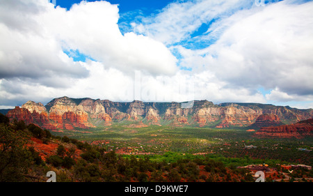 Red clay adorns the lovely mountain and valley view in Sedona, Arizona, on 26 May 2013. Stock Photo