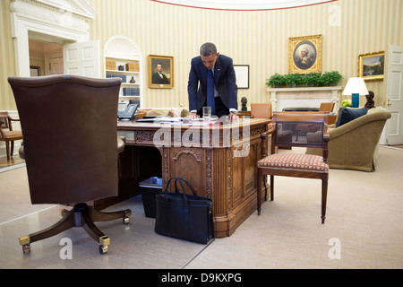 US President Barack Obama works on his remarks in the Oval Office before delivering a statement on the situation regarding the Internal Revenue Service May 15, 2013 in Washington, DC. Stock Photo