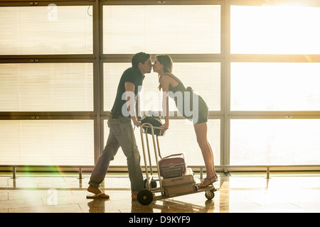 Young couple in airport Stock Photo