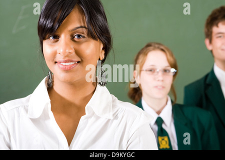 young high school teacher and students in classroom Stock Photo