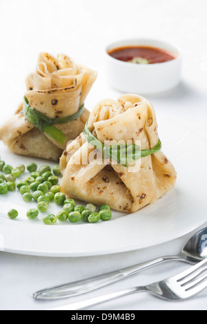Veg Potlies served with green peas Stock Photo
