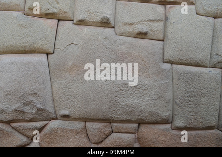 Famous Inca carved 12-angled stone in the Hatun Rumyuc wall in Cuzco Stock Photo