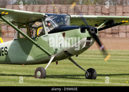 Cessna O-1e Bird Dog N134Tt taxiing along runway after landing at Breighton Airfield Stock Photo