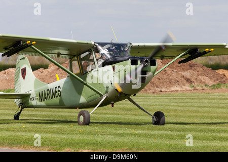 Cessna O-1e Bird Dog N134TT taxiing along runway after landing at Breighton Airfield Stock Photo
