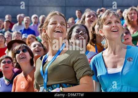 A thousand-voice adult choir in support of the charity WaterAid, Thames Festival, London, UK Stock Photo