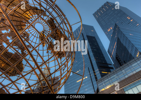 The steel globe outside Trump International Hotel and the towers of the Time Warner Center in Columbus Circle in New York City. Stock Photo