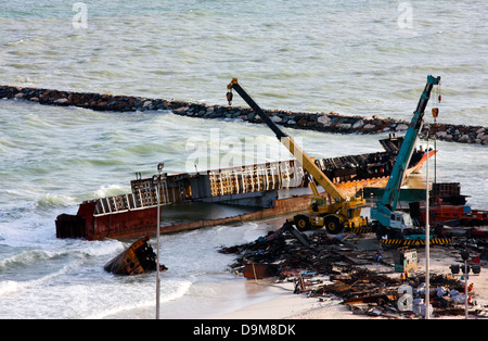 Ship breaking on the Beach, Coastal Freighter run aground in Ajman, United Arab Emirates Stock Photo