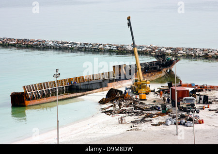 Ship breaking on the Beach, Coastal Freighter run aground in Ajman, United Arab Emirates Stock Photo