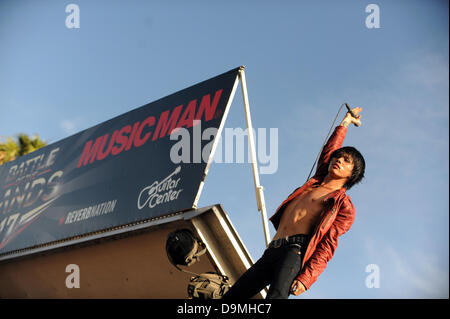 June 22, 2013 - Pomona, California, USA - Musician-TERUFUMI TAMANO-keyboard player for the Japanese metalcore band CROSSFAITH from Osaka, standing on top of the speaker tower during the bands encore at Vans Warped Tour 2013, Pomona Fairplex, Pomona, California, USA, June 21, 2013..Credit Image  cr  Scott Mitchell (Credit Image: © Scott Mitchell/ZUMAPRESS.com) Stock Photo