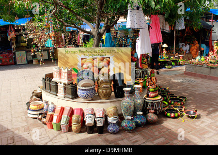 Shops displayng ethnic dresses, jewelery and souvenirs at the Delhi Haat Stock Photo