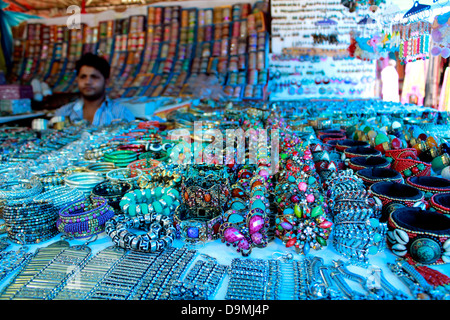 Shops displayng ethnic dresses, jewelery and souvenirs at the Delhi Haat Stock Photo