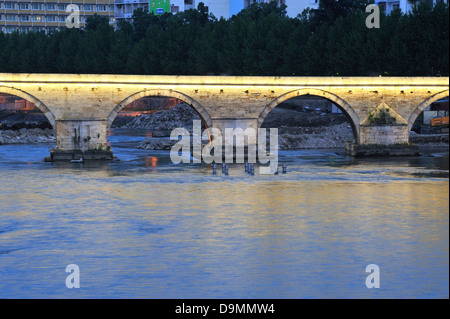 Old Stone Bridge and river Vardar at dusk, Skopje, Macedonia Stock Photo