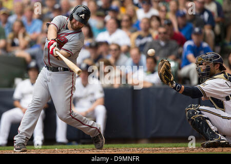 Atlanta Braves first baseman Freddie Freeman and New York Yankees  outfielder Aaron Judge share a laugh at first base with Freeman giving him  a pat on the shoulder after Judge hit a