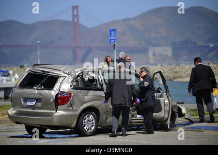 Feb. 19, 2013 - San Francisco, CA, USA - Police and fire officials investigate a van after it was pulled from the San Francisco Bay on Saturday, June22, 2013 in San Francisco, Calif. A woman jumped a curb and plunged to her death in the vehicle. (Credit Image: © Josh Edelson/ZUMAPRESS.com) Stock Photo