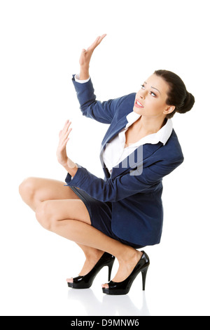 Scared businesswoman defending herself, isolated on white background  Stock Photo