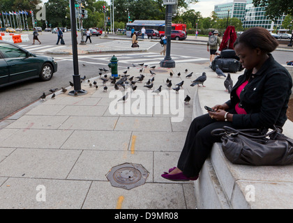 Woman looking at her mobile phone Stock Photo