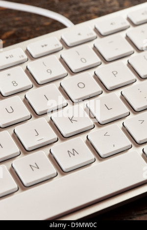Grey Computer Keyboard with white keys for typing Stock Photo