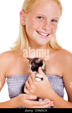 cute freckled teen girl holding a little kitten isolated on white Stock Photo