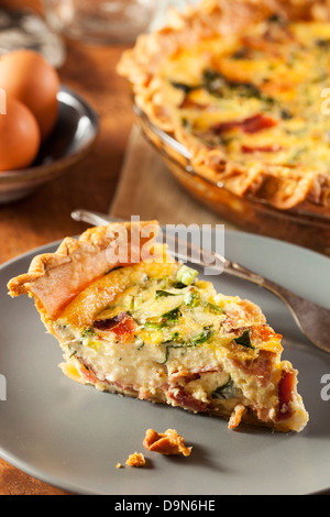 Homemade Spinach and Bacon Egg Quiche in a pie crust Stock Photo