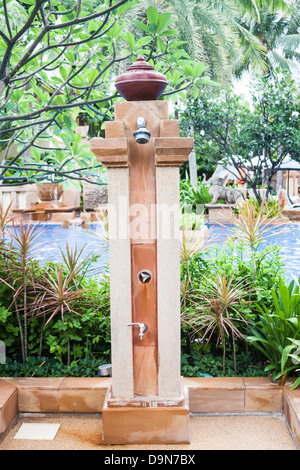 Outdoor shower at swimming pool in resort Stock Photo