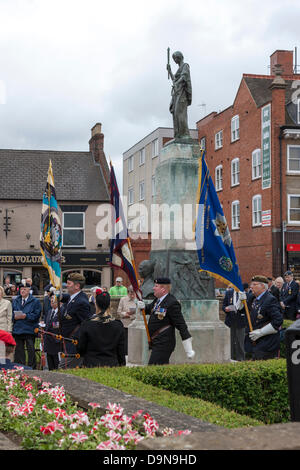 Northampton UK. Memorial Garden Abington Square. 23rd June 2013.The drumhead service of commemoration to mark the 60th anniversary of the armistice of the Korean War (1950-53). Northampton Borough Council, the Royal British Legion and the Korean Veterans Association hold a static parade in the Memorial Garden. The standards of military units draped over drums piled to create an altar Credit:  Keith J Smith./Alamy Live News Stock Photo