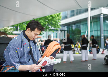 Young Okinawan man in traditional costume at Ryukyu Mura Okinawa Japan ...