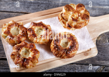 Soft newly-baked rolls on an old kitchen table Stock Photo