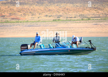 Three fishermen pass their time at Lake Powell in Utah. Stock Photo